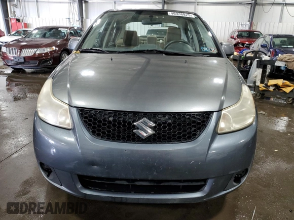 2009 Suzuki SX4 Man FWD with VIN JS2YC412496200218, listed as a Copart auction lot 46938825 with 63,909 mi miles and Salvage Title. Bid and sale history available at carsss.com. Image 5.