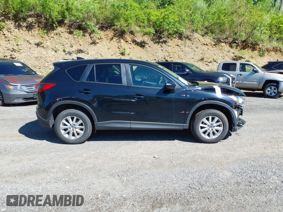2016 Mazda CX-5 Touring with VIN JM3KE4CY4G0738713, listed as a IAAI auction lot 41998597 with 146,595 mi miles and . Bid and sale history available at carsss.com. Image 13.