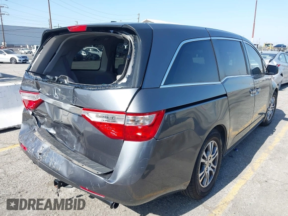 2011 Honda Odyssey EX-L with VIN 5FNRL5H64BB070836, listed as a IAAI auction lot 42520878 with 162,316 mi miles and . Bid and sale history available at DreamBid. Image 4.