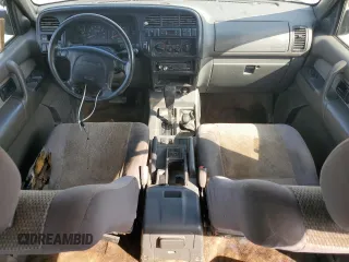 1999 Isuzu Trooper S with VIN JACDJ58X6X7924973, listed as a Copart auction lot 57881235 with 269,301 mi miles and Salvage title. Bid and sale history available at DreamBid. Image 8.