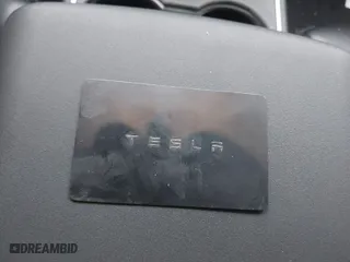 2018 Tesla Model 3 Long Range Battery with VIN 5YJ3E1EB2JF180275, listed as a IAAI auction lot 41196064 with 110,535 mi miles. Bid and sale history available at carsss.com. Image 11.