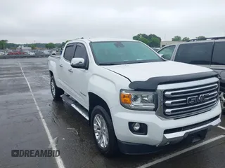 2018 GMC Canyon 4WD SLT z VIN 1GTG6DEN3J1189117, wystawiony jako IAAI lot #42367344 z przebiegiem 131 353 mil mil oraz . Historia ofert i sprzedaży dostępna na DreamBid. Obrazek 1.