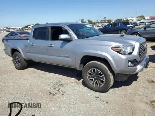 2021 Toyota Tacoma 4WD SR5 with VIN 3TMDZ5BN9MM099787, listed as a Copart auction lot 49717425 with 56,374 mi miles and Salvage Title. Bid and sale history available at carsss.com. Image 4.