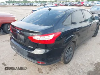 2014 Ford Focus SE with VIN 1FADP3F21EL157488, listed as a IAAI auction lot 42120325 with 198,658 mi miles and . Bid and sale history available at DreamBid. Image 4.