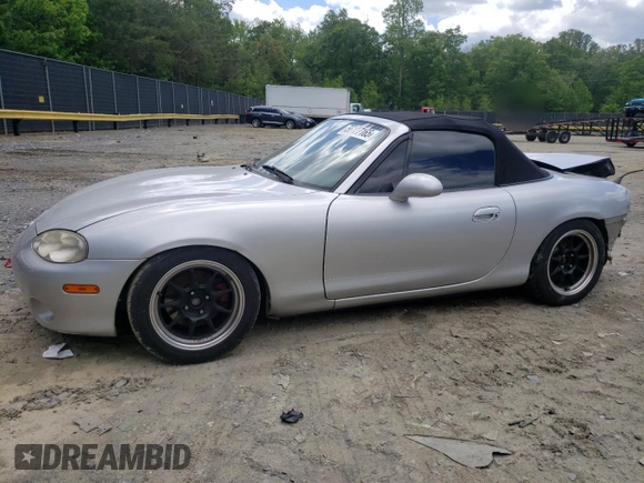 2004 Mazda MX-5 Miata LS with VIN JM1NB353640400140, listed as a Copart auction lot 56127165 with 123,276 mi miles and Salvage title. Bid and sale history available at DreamBid. Image 1.