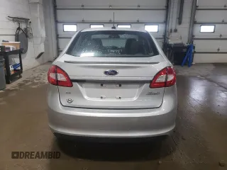 2013 Ford Fiesta SE z VIN 3FADP4BJ8DM220456, wystawiony jako Copart lot #58596825 z przebiegiem 115 933 mil mil oraz Szkoda całkowita • Salvage title. Historia ofert i sprzedaży dostępna na DreamBid. Obrazek 6.