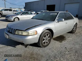 2003 Cadillac Seville Touring STS z VIN 1G6KY54923U101998, wystawiony jako Copart lot #74029304 z przebiegiem 134 157 mil mil oraz Szkoda całkowita • Salvage title. Historia ofert i sprzedaży dostępna na DreamBid. Obrazek 1.