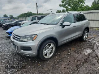 2011 Volkswagen Touareg with VIN WVGFG9BP3BD003163, listed as a Copart auction lot 63349305 with 140,532 mi miles and Clean title. Bid and sale history available at DreamBid. Image 1.