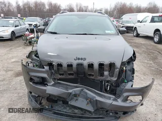 2016 Jeep Cherokee 75th Anniversary with VIN 1C4PJMCB0GW156076, listed as a IAAI auction lot 41946760 with 105,571 mi miles. Bid and sale history available at carsss.com. Image 13.