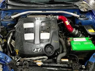 2007 Hyundai Tiburon GT z VIN KMHHN66F07U254955, wystawiony jako Copart lot #82239034 z przebiegiem 193 900 mil mil oraz Szkoda całkowita • Salvage title. Historia ofert i sprzedaży dostępna na DreamBid. Obrazek 13.