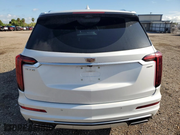 2023 Cadillac XT6 FWD Premium Luxury with VIN 1GYKPCRS5PZ120905, listed as a Copart auction lot 64374254 with 30,694 mi miles and Salvage title. Bid and sale history available at DreamBid. Image 6.