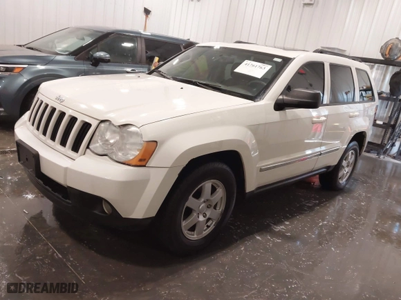 2010 Jeep Grand Cherokee Laredo with VIN 1J4PR4GK1AC143486, listed as a IAAI auction lot 41761763 with 159,139 mi miles. Bid and sale history available at carsss.com. Image 2.