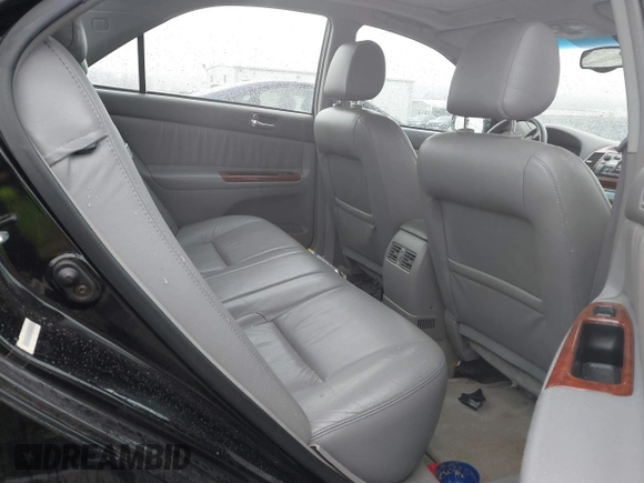 2003 Toyota Camry LE with VIN 4T1BE30K13U144114, listed as a IAAI auction lot 41829879 with 60,385 mi miles and . Bid and sale history available at DreamBid. Image 8.