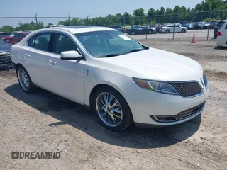 2014 Lincoln MKS z VIN 1LNHL9DK4EG612481, wystawiony jako IAAI lot #42358993 z przebiegiem 99 313 mil mil oraz . Historia ofert i sprzedaży dostępna na DreamBid. Obrazek 1.