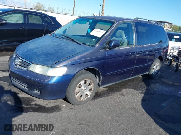2004 Honda Odyssey EX z VIN 5FNRL18614B080980, wystawiony jako IAAI lot #41940014 z przebiegiem 233 465 mil mil oraz . Historia ofert i sprzedaży dostępna na DreamBid. Obrazek 2.