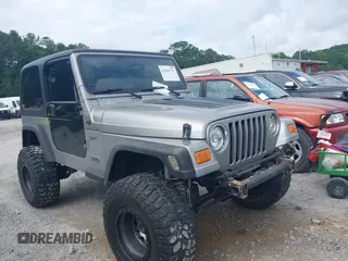 2002 Jeep Wrangler Sport with VIN 1J4FA49S52P717811, listed as a IAAI auction lot 42449753 with 252,258 mi miles and . Bid and sale history available at DreamBid. Image 1.