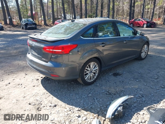 2015 Ford Focus Titanium with VIN 1FADP3J25FL333743, listed as a IAAI auction lot 41857057 with 120,917 mi miles and . Bid and sale history available at carsss.com. Image 4.