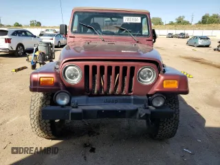 2002 Jeep Wrangler Sahara with VIN 1J4FA59S92P708647, listed as a Copart auction lot 74851654 with 131,794 mi miles and Salvage Title. Bid and sale history available at carsss.com. Image 5.