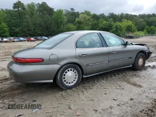 1999 Mercury Sable LS with VIN 1MEFM53U6XG646248, listed as a Copart auction lot 57859405 with 128,286 mi miles and Salvage title. Bid and sale history available at DreamBid. Image 3.