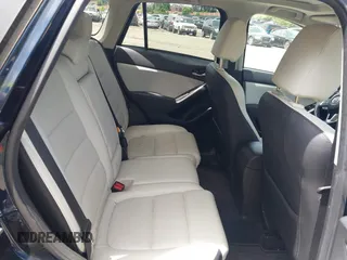 2016 Mazda CX-5 Grand Touring z VIN JM3KE4DY1G0817562, wystawiony jako IAAI lot #42289929 z przebiegiem 135 476 mil mil oraz . Historia ofert i sprzedaży dostępna na DreamBid. Obrazek 8.