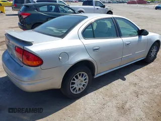 2004 Oldsmobile Alero GL1 z VIN 1G3NL52F54C206964, wystawiony jako IAAI lot #42160307 z przebiegiem 129 808 mil mil oraz . Historia ofert i sprzedaży dostępna na DreamBid. Obrazek 4.