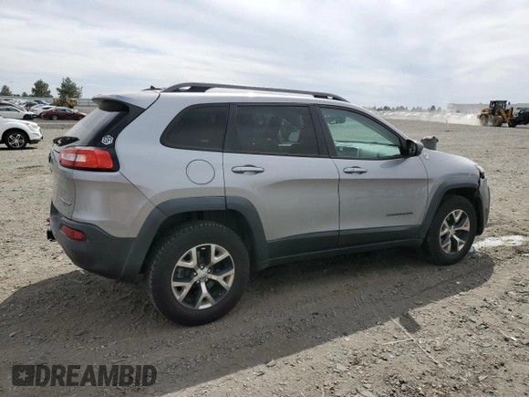 2014 Jeep Cherokee Trailhawk with VIN 1C4PJMBS6EW159174, listed as a Copart auction lot 56097795 with 130,299 mi miles and Salvage title. Bid and sale history available at DreamBid. Image 3.