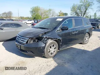 2012 Honda Odyssey EX-L with VIN 5FNRL5H6XCB016801, listed as a IAAI auction lot 42112141 with 164,671 mi miles and . Bid and sale history available at carsss.com. Image 2.