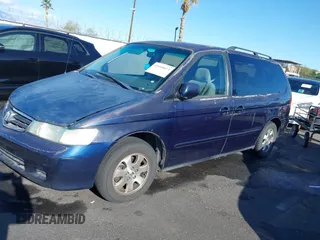 2004 Honda Odyssey EX z VIN 5FNRL18614B080980, wystawiony jako IAAI lot #41940014 z przebiegiem 233 465 mil mil oraz . Historia ofert i sprzedaży dostępna na DreamBid. Obrazek 6.