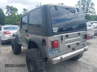 2002 Jeep Wrangler Sport with VIN 1J4FA49S52P717811, listed as a IAAI auction lot 42449753 with 252,258 mi miles and . Bid and sale history available at DreamBid. Image 3.