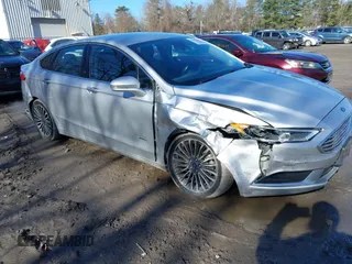 2018 Ford Fusion Energi SE with VIN 3FA6P0PU0JR164192, listed as a IAAI auction lot 41821301 with 114,141 mi miles. Bid and sale history available at carsss.com. Image 1.