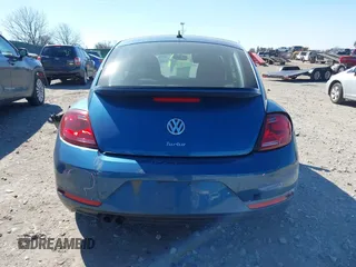 2018 Volkswagen Beetle S z VIN 3VWFD7ATXJM711734, wystawiony jako IAAI lot #41704497 z przebiegiem 66 702 mil mil oraz . Historia ofert i sprzedaży dostępna na DreamBid. Obrazek 16.