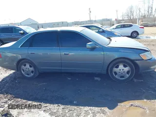2003 Toyota Avalon XL z VIN 4T1BF28B33U293202, wystawiony jako IAAI lot #41768148 z przebiegiem 157 992 mil mil oraz . Historia ofert i sprzedaży dostępna na DreamBid. Obrazek 13.