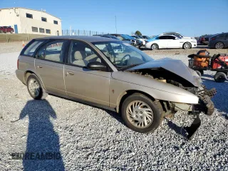 1999 Saturn SW z VIN 1G8ZK8277XZ162136, wystawiony jako Copart lot #83206604 z przebiegiem Nie podano mil oraz Szkody całkowita. Historia ofert i sprzedaży dostępna na DreamBid. Obrazek 4.