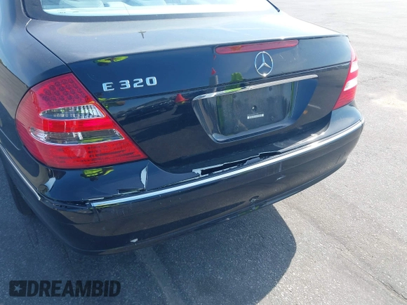 2003 Mercedes-Benz E-Class 3.2L with VIN WDBUF65J33A112308, listed as a IAAI auction lot 41871334 with 138,522 mi miles. Bid and sale history available at carsss.com. Image 6.