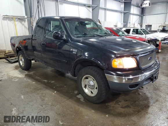 2000 Ford F-150 XL with VIN 1FTRX18L7YNA85909, listed as a Copart auction lot 56056165 with 134,765 mi miles and Salvage title. Bid and sale history available at DreamBid. Image 4.