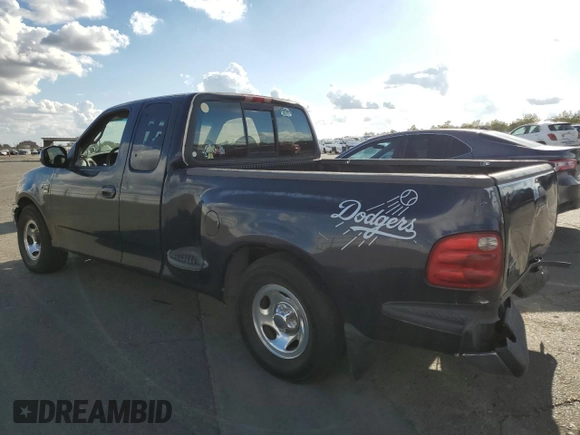2000 Ford F-150 with VIN 1FTRX07W3YKA56561, listed as a Copart auction lot 81149654 with 185,967 mi miles and Salvage title. Bid and sale history available at DreamBid. Image 2.
