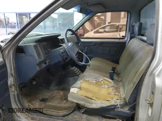 1987 Nissan Hardbody E z VIN JN6ND11S1HW006640, wystawiony jako Copart lot #78160004 z przebiegiem 403 406 mil mil oraz Szkody całkowita. Historia ofert i sprzedaży dostępna na DreamBid. Obrazek 7.