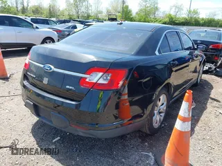 2011 Ford Taurus SEL with VIN 1FAHP2EW6BG127102, listed as a IAAI auction lot 42131123 with 168,965 mi miles. Bid and sale history available at carsss.com. Image 4.