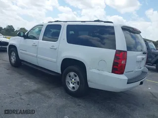2009 Chevrolet Suburban LT w/2LT with VIN 1GNFC26JX9J108623, listed as a IAAI auction lot 42115456 with 144,370 mi miles. Bid and sale history available at carsss.com. Image 3.