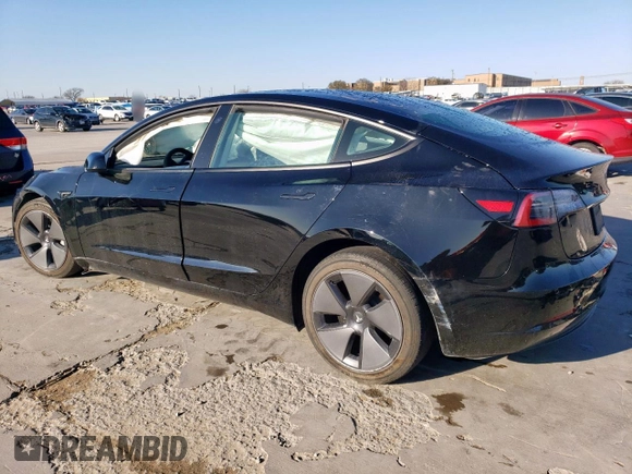 2021 Tesla Model 3 Standard Range Plus with VIN 5YJ3E1EA2MF977007, listed as a Copart auction lot 48516075 with Not Provided miles and Salvage Title. Bid and sale history available at DreamBid. Image 2.