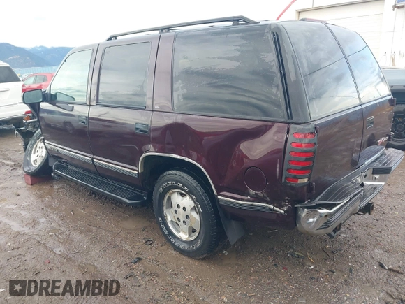 1997 GMC Yukon with VIN 1GKEK13R0VJ755574, listed as a IAAI auction lot 41158932 with 212,668 mi miles. Bid and sale history available at carsss.com. Image 3.