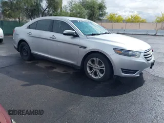 2015 Ford Taurus SEL z VIN 1FAHP2E8XFG161115, wystawiony jako IAAI lot #42196604 z przebiegiem 153 190 mil mil oraz . Historia ofert i sprzedaży dostępna na DreamBid. Obrazek 1.