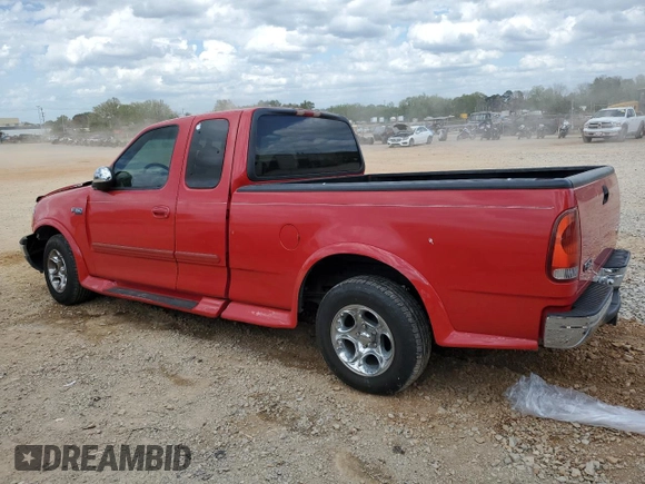 1999 Ford F-150 with VIN 1FTZX1725XNA33332, listed as a Copart auction lot 51867455 with 163,023 mi miles and Salvage title. Bid and sale history available at DreamBid. Image 2.