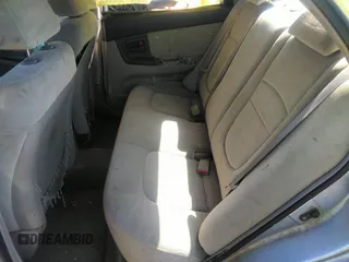 2005 Kia Spectra LX with VIN KNAFE121055121500, listed as a IAAI auction lot 39677018 with 142,307 mi miles. Bid and sale history available at carsss.com. Image 8.
