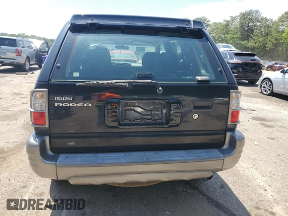2003 Isuzu Rodeo z VIN 4S2CK58W734311374, wystawiony jako Copart lot #57949325 z przebiegiem 247 580 mil mil oraz Tytuł czysty. Historia ofert i sprzedaży dostępna na DreamBid. Obrazek 6.