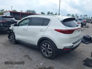 2021 Kia Sportage EX with VIN KNDPN3AC5M7856515, listed as a IAAI auction lot 41879128 with 56,537 mi miles and . Bid and sale history available at DreamBid. Image 3.