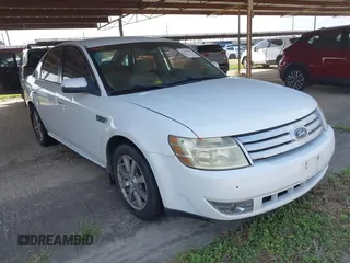 2008 Ford Taurus SEL z VIN 1FAHP24W68G143505, wystawiony jako IAAI lot #41932592 z przebiegiem 238 542 mil mil oraz . Historia ofert i sprzedaży dostępna na DreamBid. Obrazek 1.