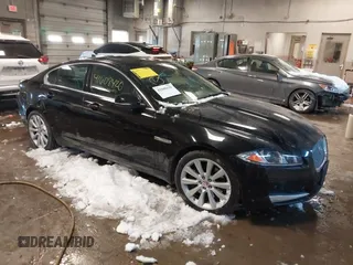 2014 Jaguar XF V6 SC with VIN SAJWJ0EF2E8U13746, listed as a IAAI auction lot 41608420 with 141,476 mi miles. Bid and sale history available at carsss.com. Image 1.