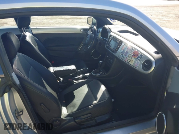 2013 Volkswagen Beetle 2.5L w/Sun/Sound/Nav with VIN 3VWJX7AT3DM663774, listed as a IAAI auction lot 41738146 with 98,064 mi miles and . Bid and sale history available at DreamBid. Image 5.