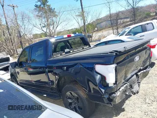 2024 Ford F-150 Lightning Flash with VIN 1FT6W3L75RWG30755, listed as a IAAI auction lot 41817158 with 1,932 mi miles and . Bid and sale history available at DreamBid. Image 14.